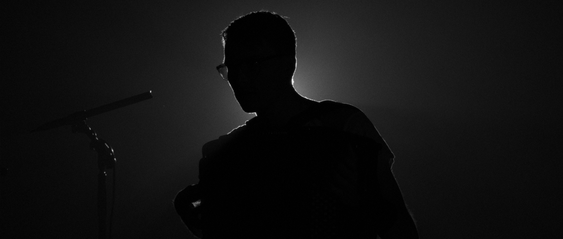 Matti Pulkki performing in silhouette
